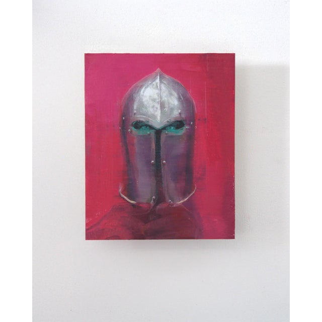 Neon Watcher presents a striking helmet set against a vibrant pink background, evoking a sense of both historical weight...