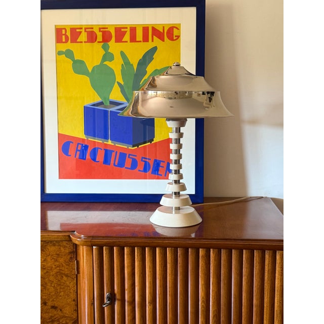 Space age table lamp France 1970s Pagoda shaped shade. Chromed plated metal, wood H 50 × 35 cm diam. Conditions: excellent...