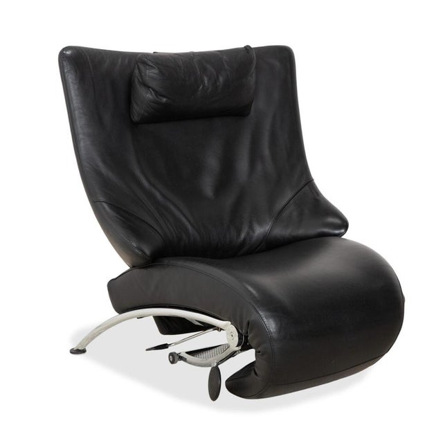 WK Wohnen Solo 699: Sculptural Aesthetics Meet Function. This armchair is far more than just a place to sit – it's an...