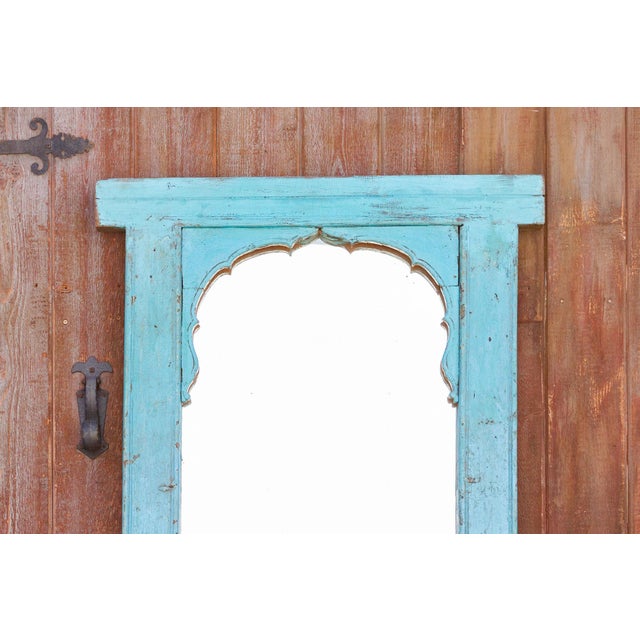 Repurposed from an antique window frame that was once in a Haveli in Jodhpur, India. This mirror preserves its original...