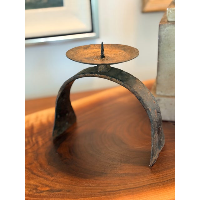 Bring historic texture and sculptural warmth to your tabletop or hearth with this vintage hand-forged wrought iron pricket...