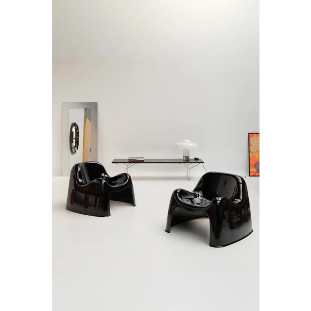 Bench designed by Harry Bertoia and produced by Knoll International. Chromed metal frame paired with a black wooden slat...