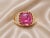 14K pink gold ring featuring a large natural cabochon amethyst (18.03 carats) surrounded by diamonds totaling 0.65 carats....