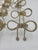 Elevate your tablescape with this stunning set of eight vintage Hollywood Regency-style napkin rings. Crafted from gold-...