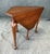 This Henkel Harris Solid Cherry Drop-Side Handkerchief Table, Model No. 5610, features the brand’s rich Finish No. 15, a...