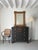 A large scale French wall mirror in limed oak with geometric detailing, dating from the early 20th century. Handmade in...