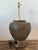 Exuding a soulful, wabi-sabi aesthetic, this vintage Thai Martaban pottery lamp is a masterclass in organic texture and...