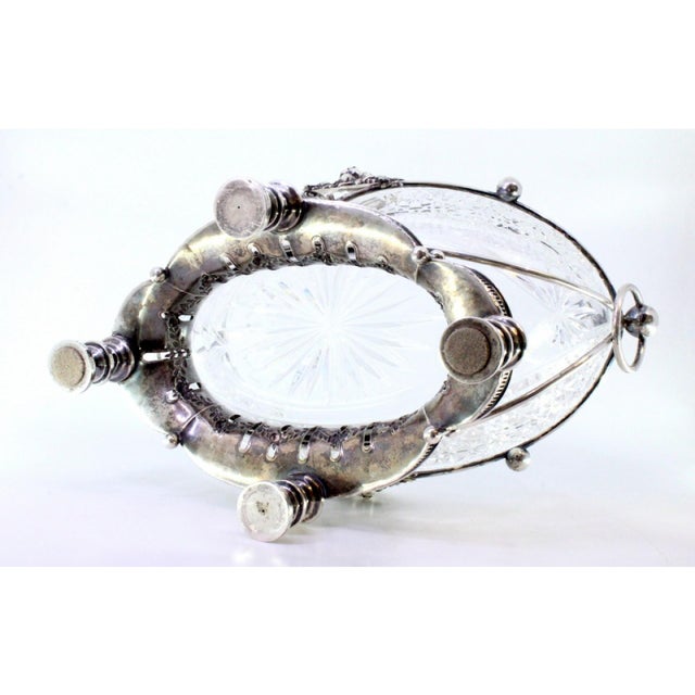 Silver and Cut Glass Fruit Bowl Centerpiece with Relief Masks and Applications, in Very Good conditions. Designed 1920 to...