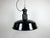 This industrial factory pendant lamp was made in former Czechoslovakia during the 1950s. It features a black enamel...