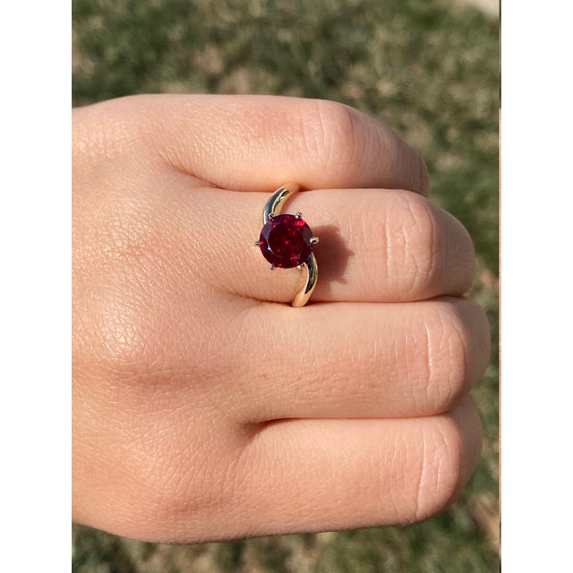 The Red Bay: Ladies 14K Laboratory Grown Ruby Engagement Ring. Crafted in 14 karat yellow gold, this ladies engagement...
