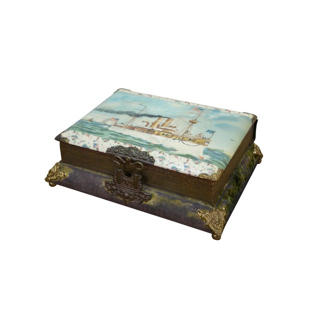 Antique Victorian music box photo album. Made of celluloid featuring the USS Maine Battleship / steam boat on the cover....