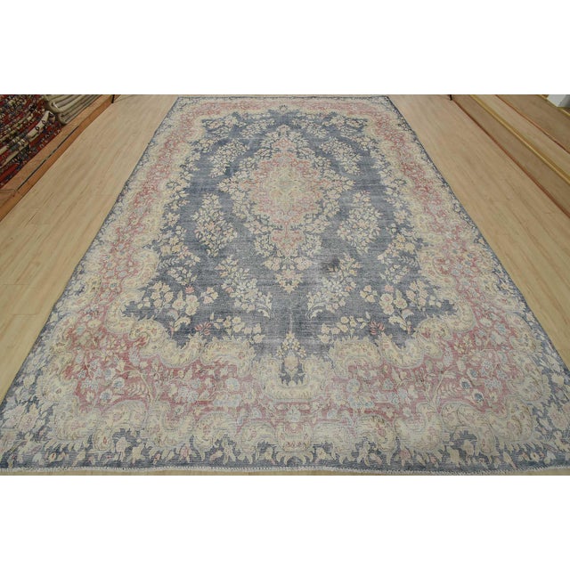 An authentic vintage traditional Kerman rug hand-knotted with fine wool and natural dyes. This oriental rug features a...