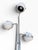 Robert Sonneman three-arm eyeball floor lamp, 1970s. Polished chrome stems and arms with white enameled ball shades on a...