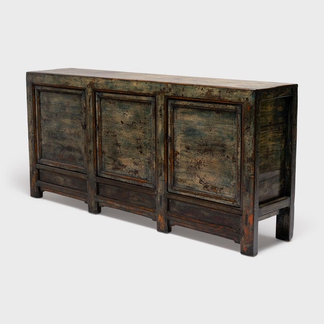 This antique Chinese sideboard from the early 20th century balances a streamlined silhouette with textured, wabi-sabi...