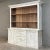 Grand 19th Century French Rustic Neoclassical Bookcase in Whitewashed Pine is a magnificent reminder of the grandeur of...