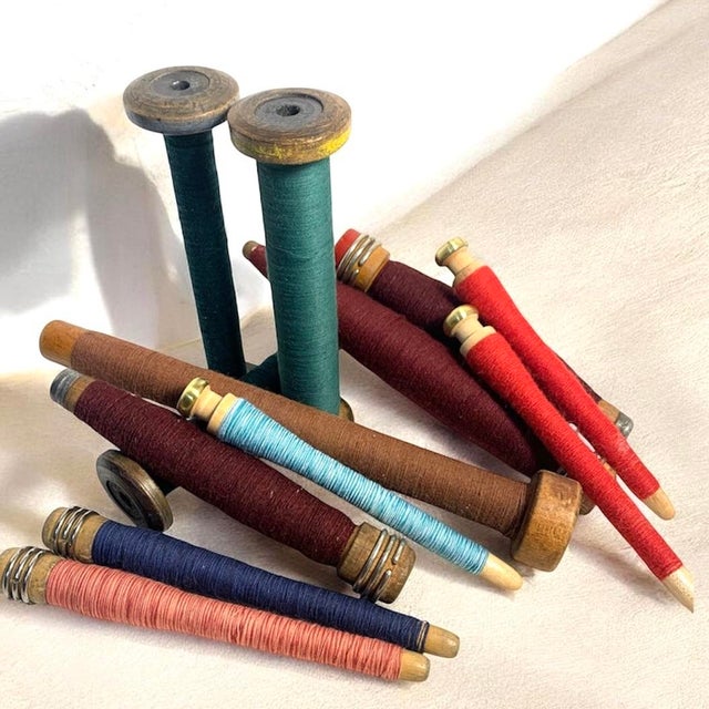 Collection of pre-1950 wooden textile mill quills and bobbins in an assortment of shapes, sizes, and traditional...