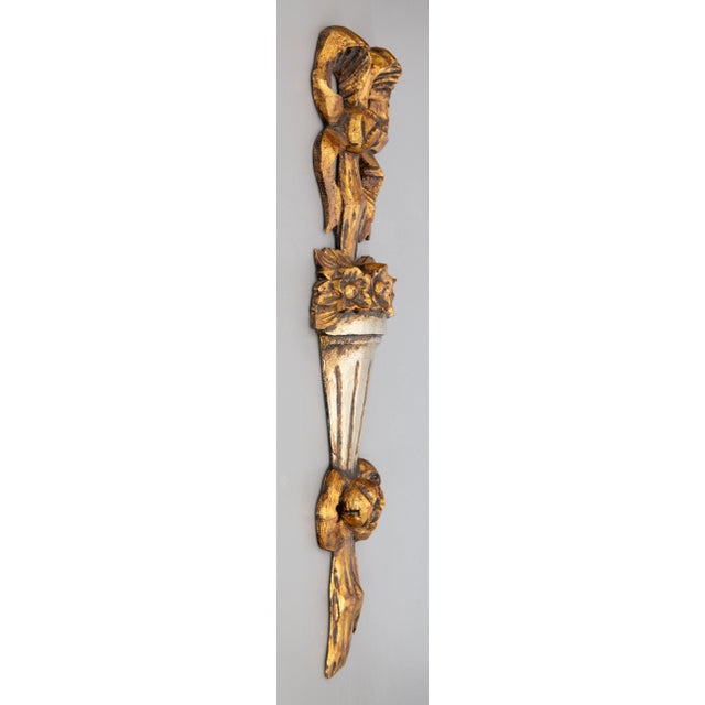 A gorgeous Mid-Century Italian hand carved gilt wood wall swag / garland / accent / ornament. There is a groove on the...