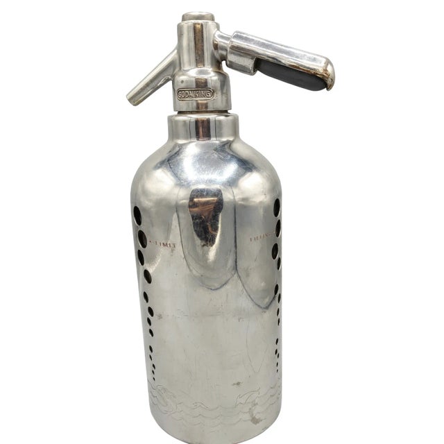 Elegant and sculptural Soda King seltzer bottle from the 1930s–40s, crafted entirely of chrome-plated metal with no...