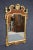 Chippendale style Walnut mirror with burled design and carved gold gilded details.
