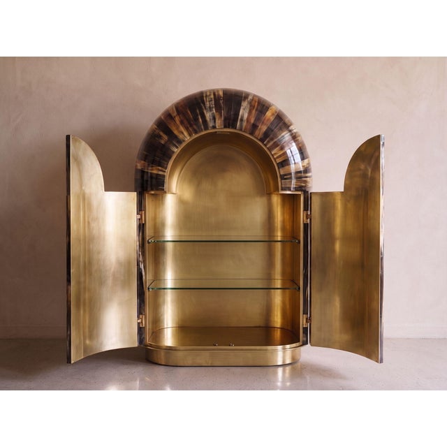Part of the Arcana Collection, this sculptural wardrobe and collector’s cabinet brings together architectural form, rich...