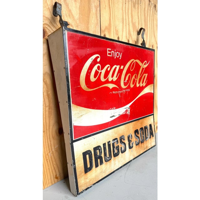 1960s Coca-Cola Trade Sign: 'Drugs & Soda' Salvaged from a pharmacy on Clematis Street, West Palm Beach, Florida A piece...