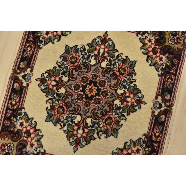 An authentic vintage traditional Sarouk rug hand-knotted with fine wool and natural dyes. This intricately woven rug...