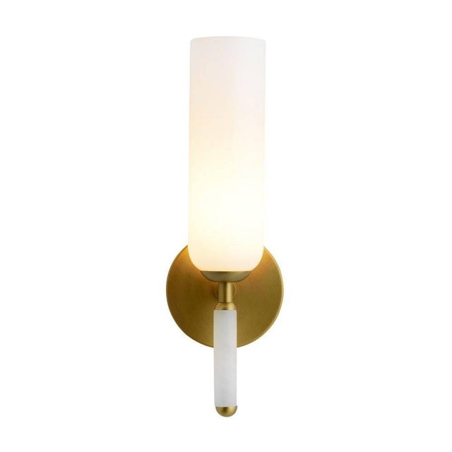 Exceptionally elegant, this sconce showcases a simple silhouette in a subtly unique design. An antique brass iron...