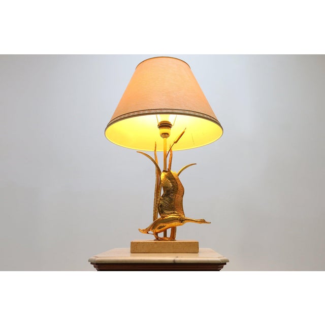 Vintage Hollywood Regency style table lamp by Italian designer Lanciotto Galeotti from the 1970s. Featuring a brass wild...