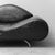 Modern-style armchair. Black leather upholstery. Metal legs. Signs of wear, as shown in photos.