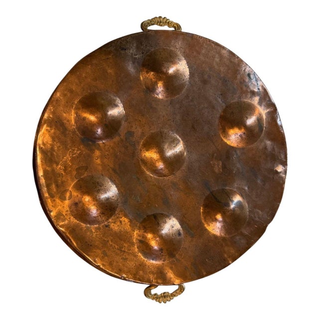 Beautiful antique French copper egg-poaching pan. A classic piece of country kitchen copper ware. It has seven shallow...