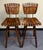 Pair of Vintage mid-century modern wooden slat and iron swivel bar stools attributed to designs by Arthur Umanoff from the...