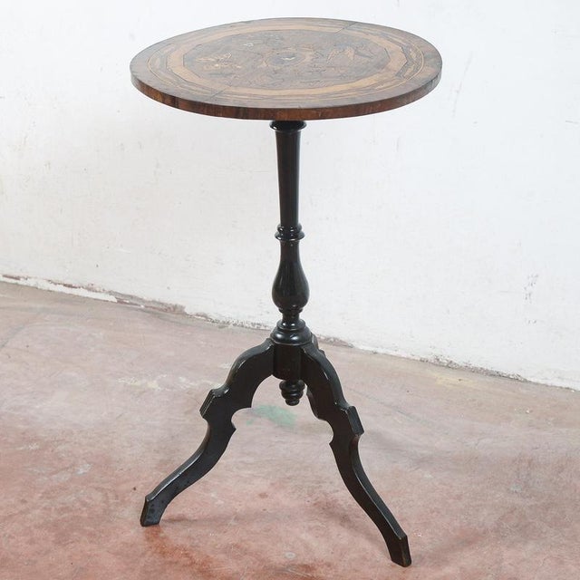 This refined circular entryway table is an elegant example of period craftsmanship, characterized by a timeless classic...