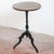 This refined circular entryway table is an elegant example of period craftsmanship, characterized by a timeless classic...