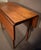 Pine American country Hepplewhite breakfast table with a plank to, circa 1785 to 1820. The overhang top rests on four...