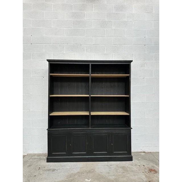 This old store shelf has been completely restored. It has three oak shelves, adjustable in height, in the upper and lower...