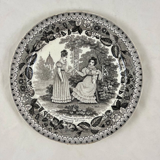 A set of four French faïence transfer printed creamware “assiette parlante” or talking plates, produced by P&H Choisy,...