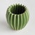 With a rounded form, deep ribbing and thickly applied glaze, this natureinspired pot is a work of art. The handfinished...
