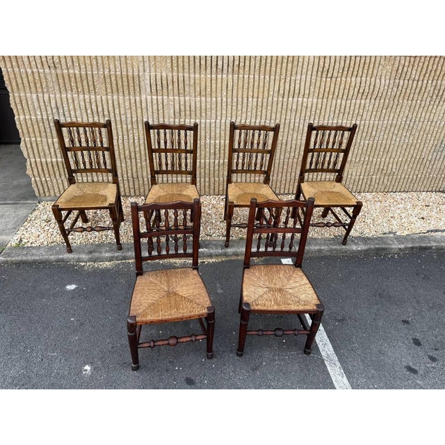 Early 20th Century 6 Antique Matching George III Lancashire Style Oak Rush Seat Side Chairs. 2 chairs are bigger and a...