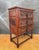 Spanish Renaissance Revival chest of drawers crafted in carved wood, dating to the mid-20th century. This piece features...