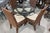 This inviting dining set features a sculptural glass-top table paired with four coordinating rattan chairs, offering a...