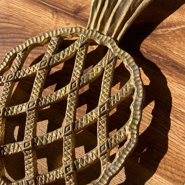 Up for consideration is a beautiful vintage brass pineapple trivet. This would look lovely in your home and it is a great...