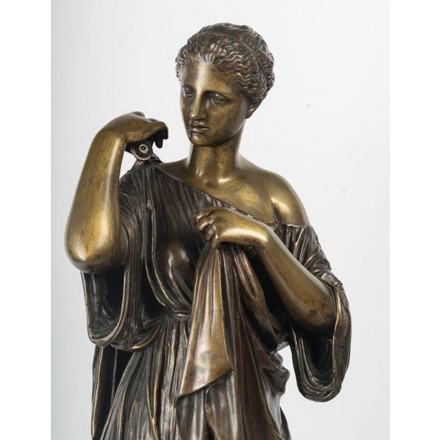 Early 20th-century patinated bronze sculpture of Diana on a wooden base. Early 20th century bronze sculpture, in the taste...