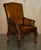 An exceptionally grand and imposing pair of fully restored antique throne-style armchairs. Featuring heavily hand-carved...