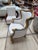 French armchair that has been reupholstered in white with a striking blue trim.