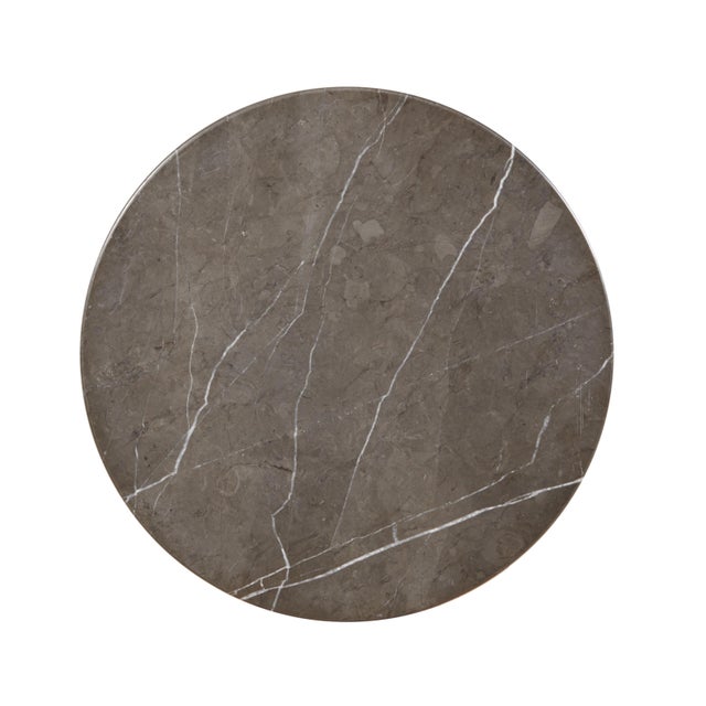 The contemporary Honed Grigio Amani marble cone base accent table reflects a modern minimalist design ethos, characterized...