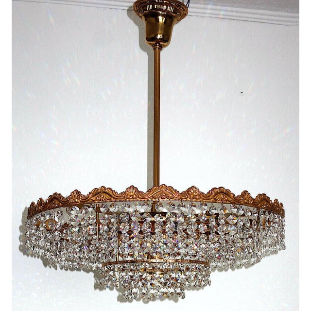 Brass and Lead Crystal Chandelier from Schröder, 1960s, in Very Good conditions. Designed 1960 to 1969 This piece has an...