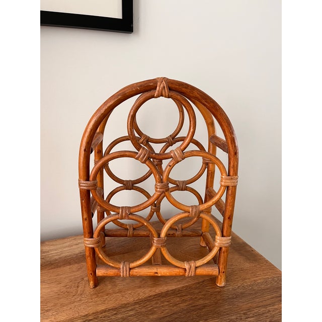 A handcrafted bamboo and rattan wine rack from the '70s. Holds 5 bottles and perfect for your boho beachy abode.