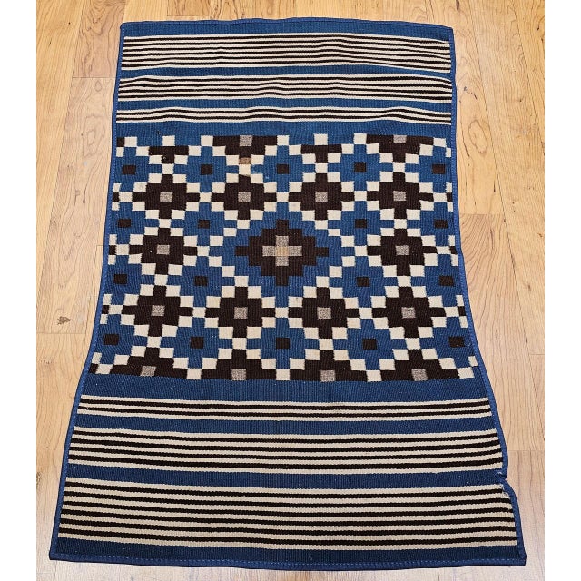 This vintage Mexican Saltillo Serape, handwoven in Coahuila, Northern Mexico circa the late 19th to early 20th century, is...