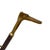 A distinctive vintage long-handled shoe horn combining a dark, finely ribbed wood shaft with warm brass-toned fittings and...