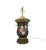 A vintage handcrafted wrought iron table lamp in the style of Chelsea House. The black handcrafted wrought iron body...